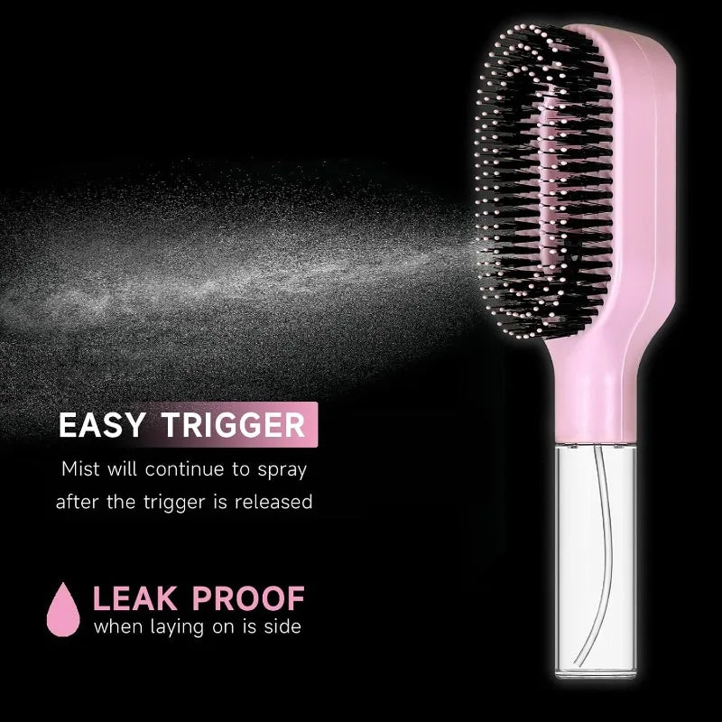 Side view of the spray hair brush releasing a fine mist against a black background