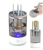 Hand holding the compact white brush cleaner to show its size